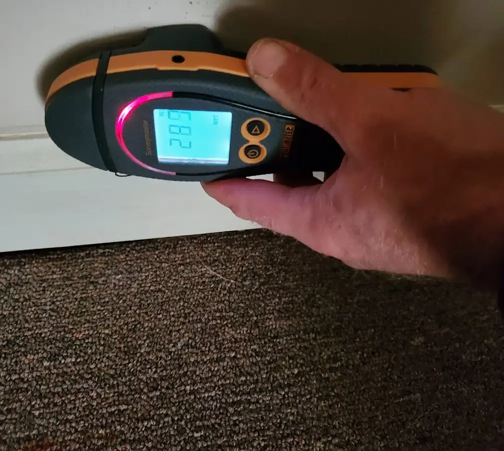 Moisture detection at baseboard during Storm Damage Restoration in Fredonia